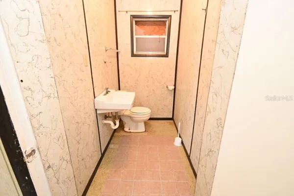 a bathroom with a sink and a toilet