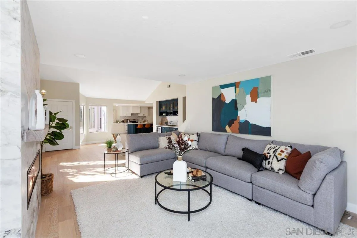 4692 Adra Way Oceanside, CA 92056 - Photo 15 of 51 a living room with furniture or couch and a potted plant