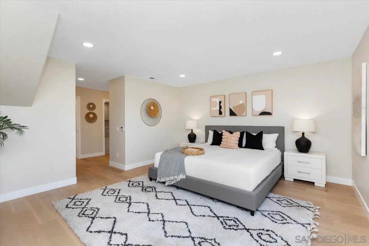 4692 Adra Way Oceanside, CA 92056 - Photo 17 of 51 a bedroom with a large bed and a table