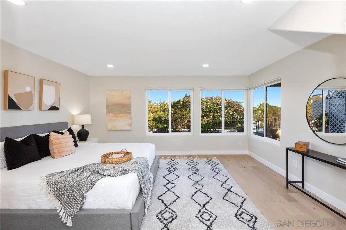 4692 Adra Way Oceanside, CA 92056 - Photo 19 of 51 a bedroom with furniture and a large window
