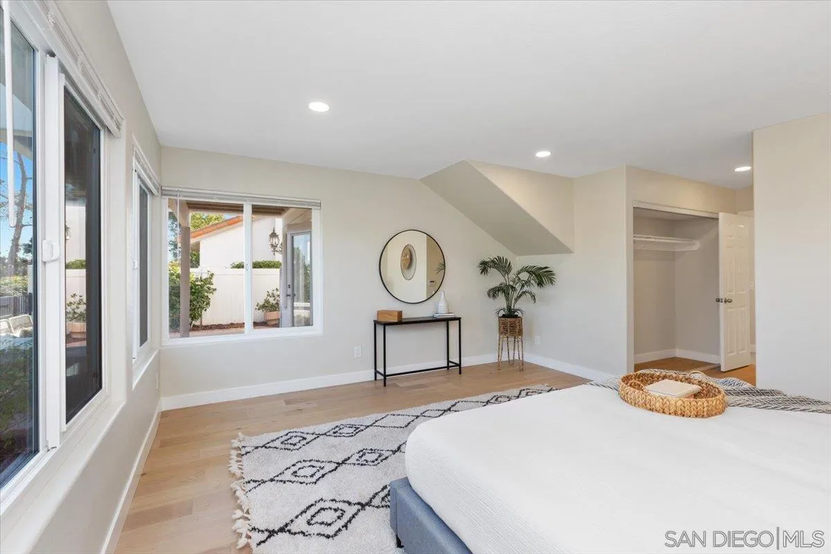 4692 Adra Way Oceanside, CA 92056 - Photo 20 of 51 a bedroom with a bed and window