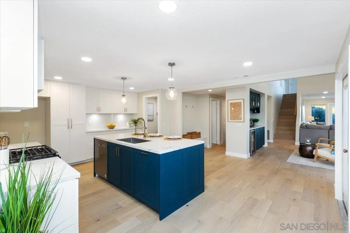 4692 Adra Way Oceanside, CA 92056 - Photo 2 of 51 a kitchen with a sink and cabinets