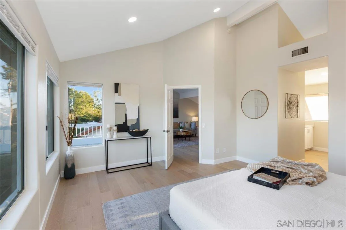 4692 Adra Way Oceanside, CA 92056 - Photo 30 of 51 a bedroom with a bed and a window