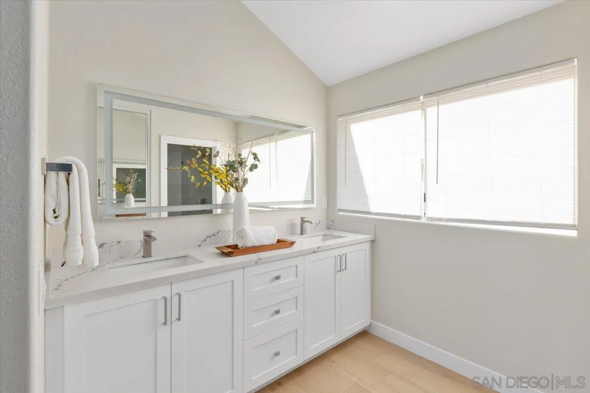4692 Adra Way Oceanside, CA 92056 - Photo 32 of 51 a bathroom with a sink and a window