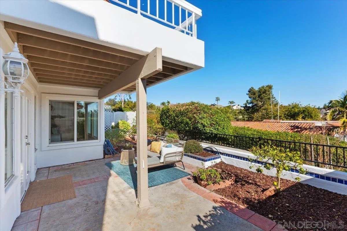 4692 Adra Way Oceanside, CA 92056 - Photo 33 of 51 a balcony with wooden floor and outdoor seating