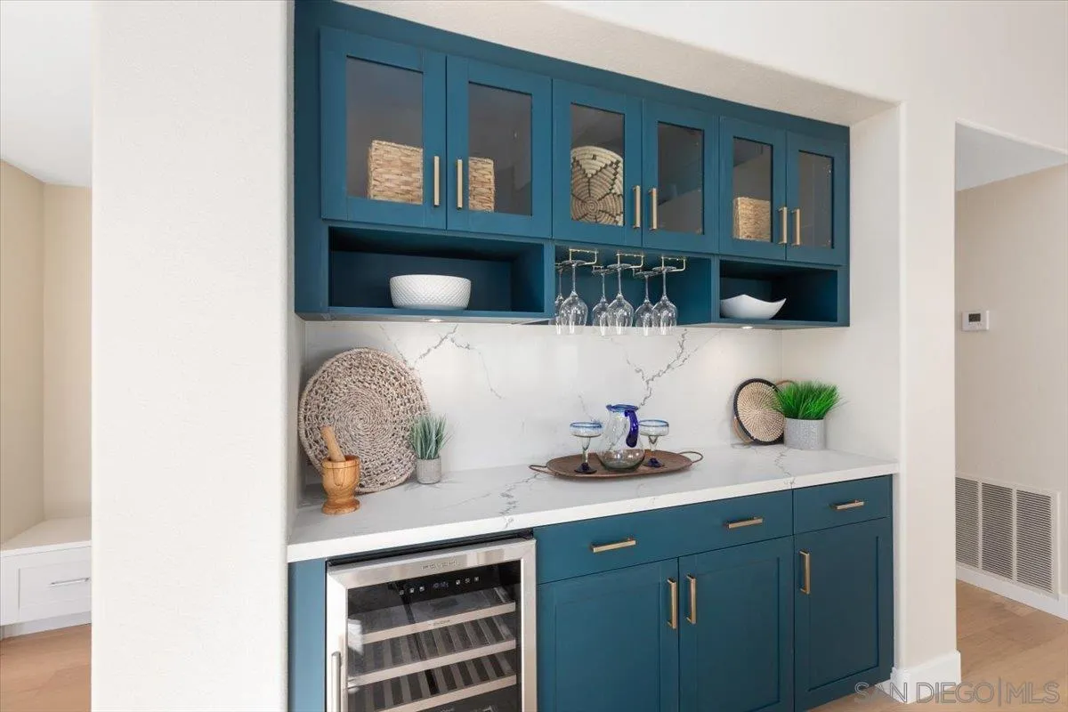 4692 Adra Way Oceanside, CA 92056 - Photo 8 of 51 a kitchen with a cabinets and a potted plant