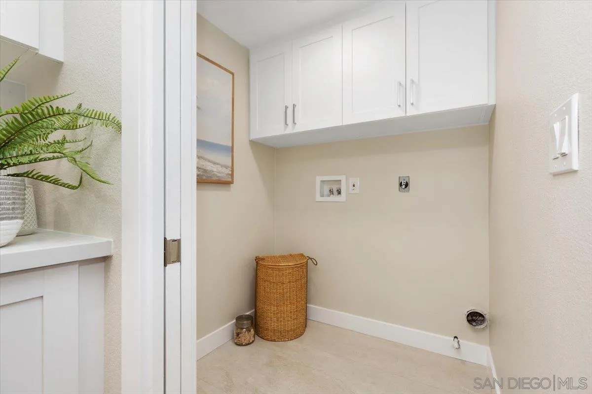 4692 Adra Way Oceanside, CA 92056 - Photo 9 of 51 a room with cabinets and a potted plant