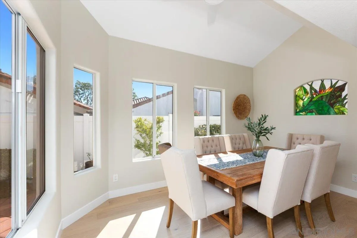 4692 Adra Way Oceanside, CA 92056 - Photo 10 of 51 a view of a dining room with furniture window and wooden floor