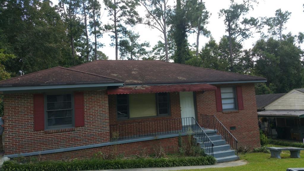 2047 Knightsbridge Road Macon, GA 31211 - Photo 1 of 9 a front view of a house with yard