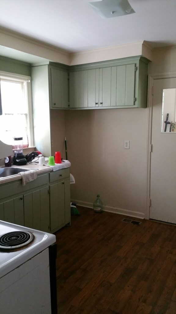 2047 Knightsbridge Road Macon, GA 31211 - Photo 3 of 9 a room with cabinets and a wooden floor