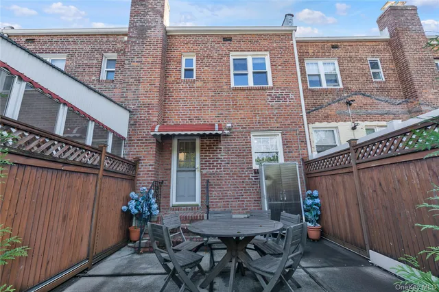 a view of a dinning table and chairs in the balcony