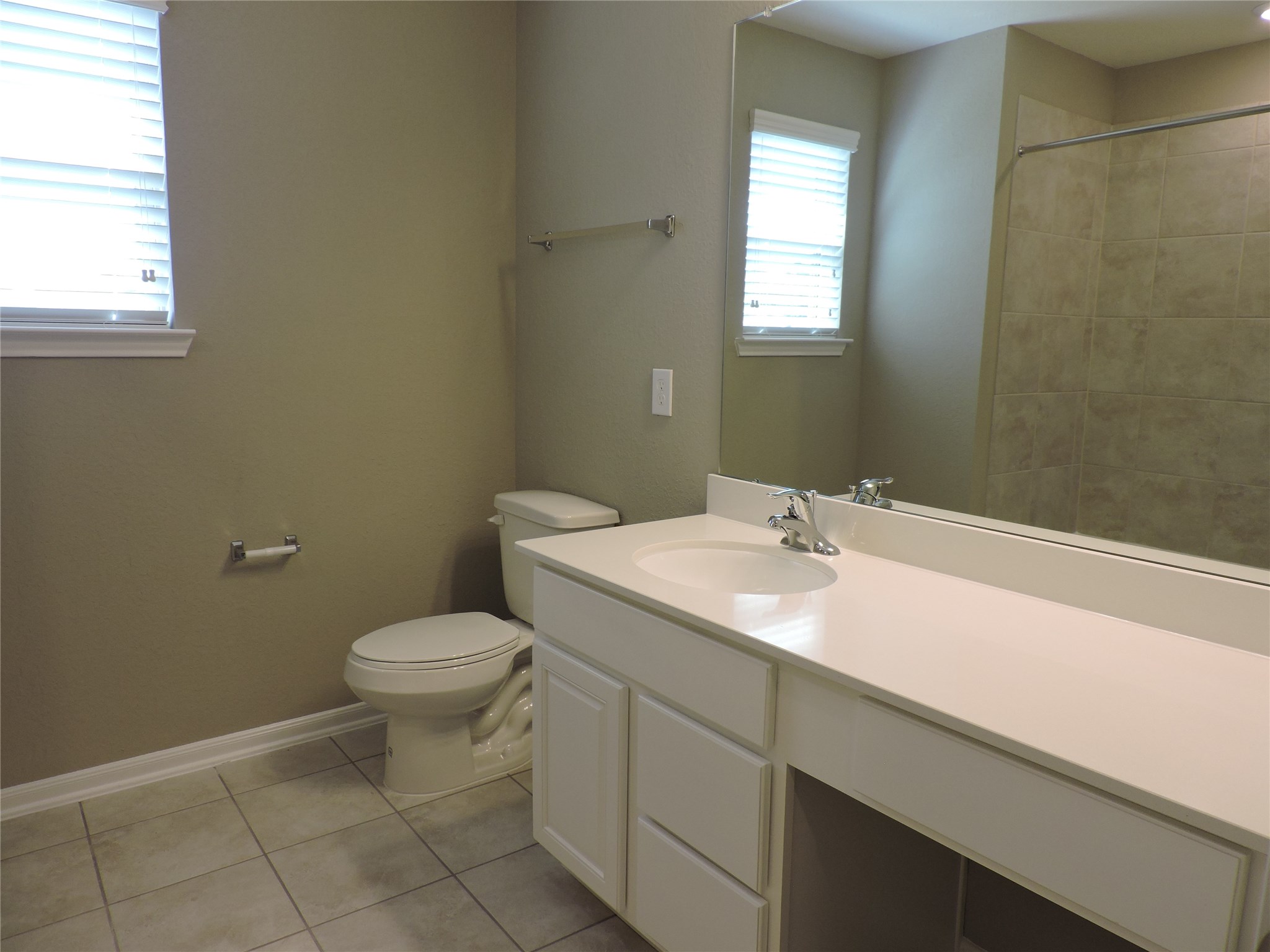 1102 Upton Court Conroe, TX 77304 - Photo 22 of 30 a bathroom with a sink and a toilet