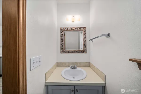 a bathroom with a sink and a mirror