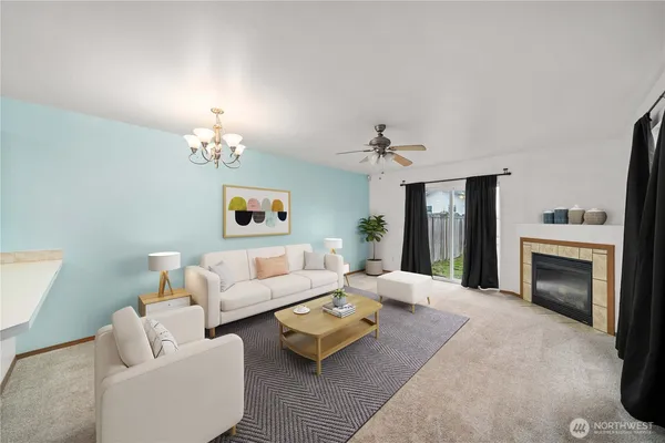 a living room with furniture and a fireplace