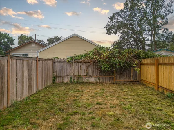 a view of a brick house with large windows
