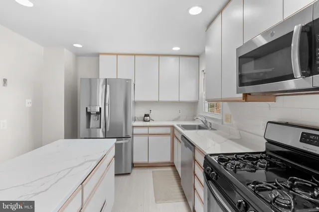 a kitchen with a stove and a microwave