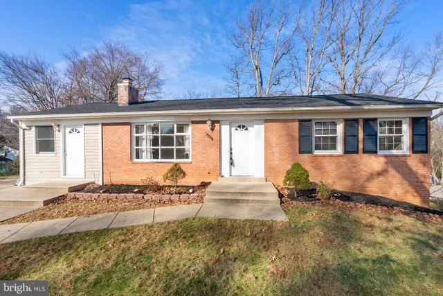 front view of a house with a yard