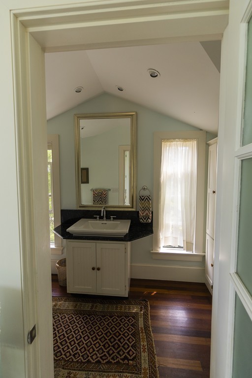 101 Associates Road Falmouth, MA 02540 - Photo 14 of 19 a bathroom with a sink a mirror and a toilet