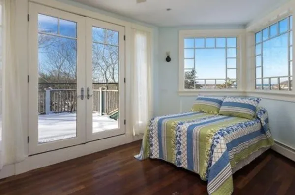 a bedroom with a bed and window