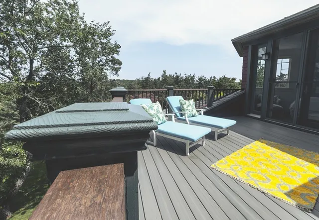 a roof deck with a table and chairs