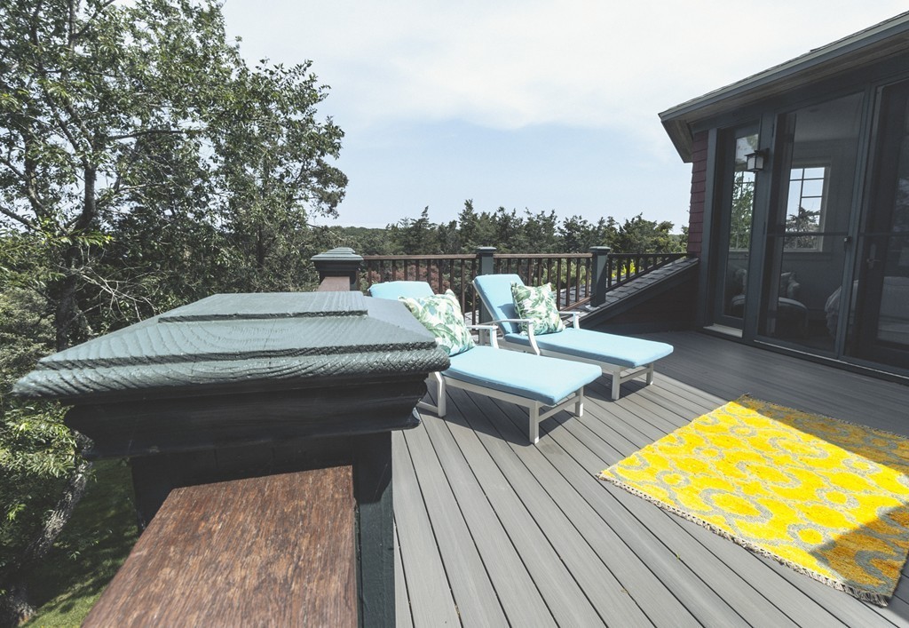 101 Associates Road Falmouth, MA 02540 - Photo 17 of 19 a roof deck with a table and chairs