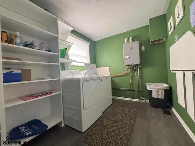 a view of a hallway with wooden floor and a dining room