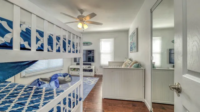 a bathroom with a sink a toilet and shower curtain