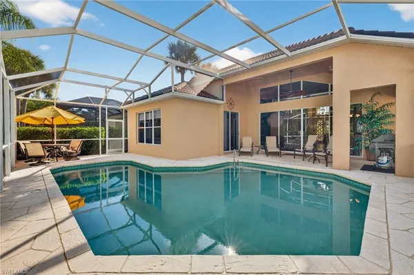 a view of a swimming pool with a patio