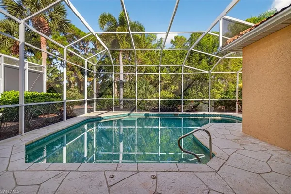 a view of a backyard with a floor to ceiling windows