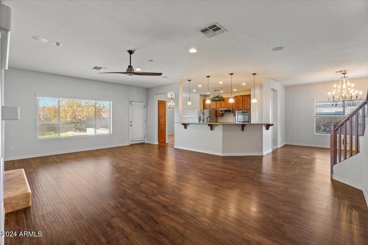 16758 West Rowel Road Surprise, AZ 85387 - Photo 14 of 59 14-Family Room & Kitchen