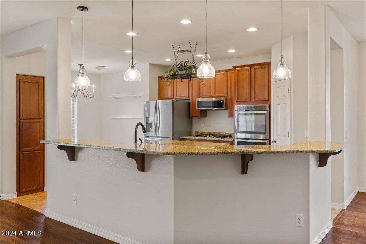 16758 West Rowel Road Surprise, AZ 85387 - Photo 16 of 59 16-Kitchen bar