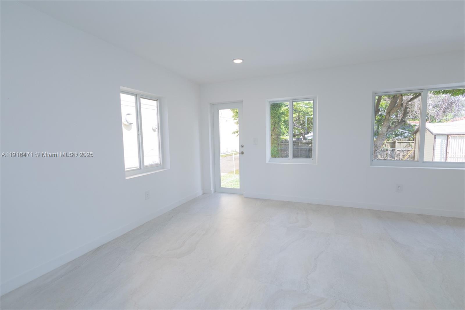 2675 Southwest 24th Terrace Miami, FL 33145 - Photo 12 of 36 an empty room with windows