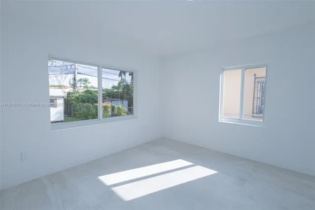 an empty room with windows