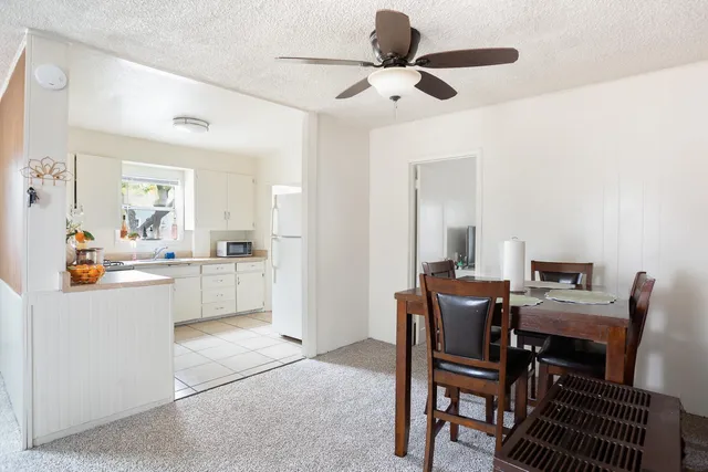 a view of kitchen and dining area with furniture