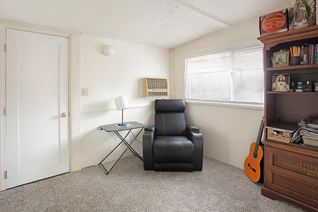 a workspace with furniture and a window