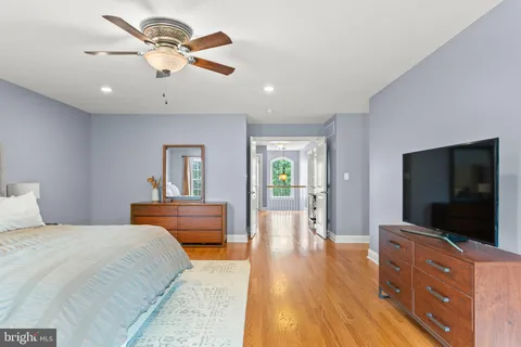 a bedroom with furniture and a flat screen tv