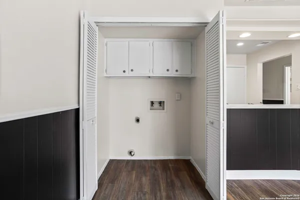 a view of bedroom with wooden floor