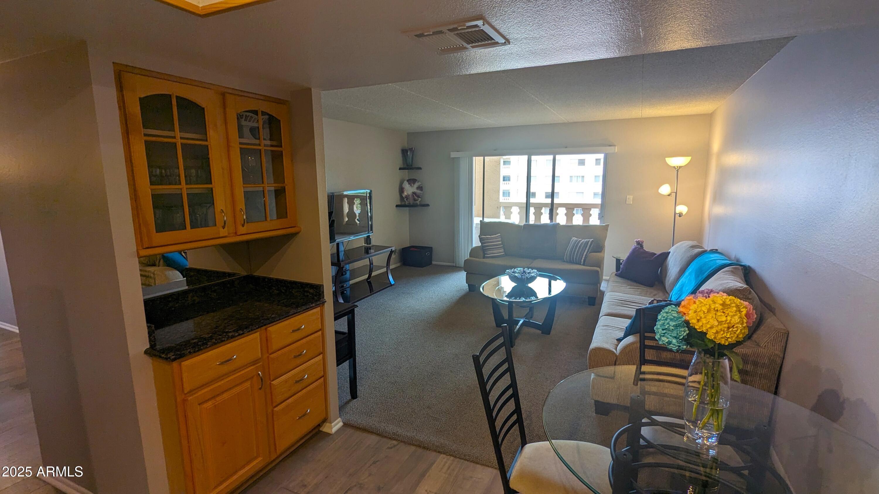 7910 East Camelback Road, Unit 302 Scottsdale, AZ 85251 - Photo 4 of 26 a view of a livingroom with furniture