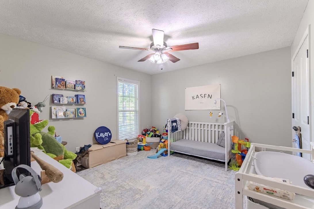 310 Ping Hl Cove Counce, TN 38326 - Photo 21 of 43 a children room with furniture and a window