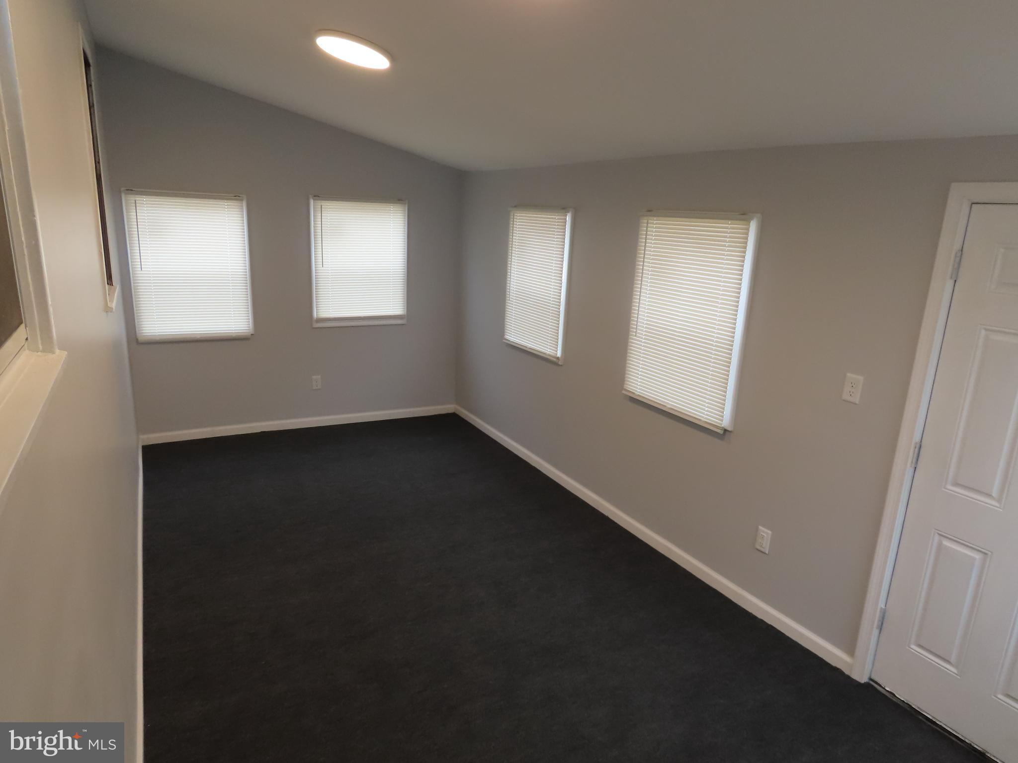 110 Robinson Drive New Castle, DE 19720 - Photo 6 of 10 a view of room with window and fireplace