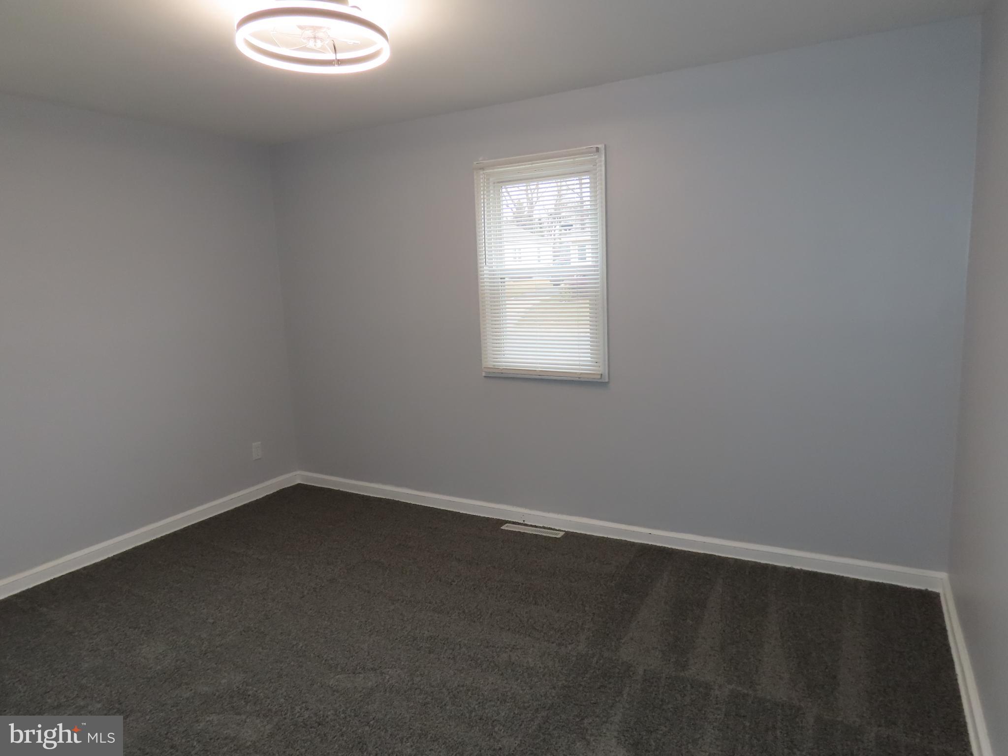 110 Robinson Drive New Castle, DE 19720 - Photo 8 of 10 an empty room with a window