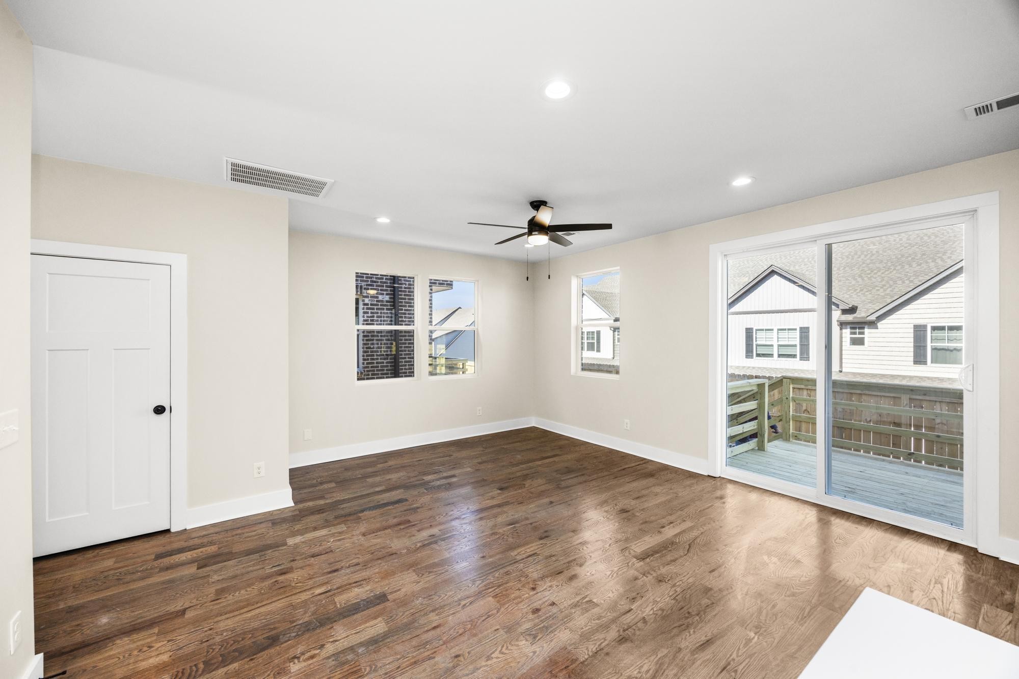 447 Sand Hill Road, Unit 4 La Vergne, TN 37086 - Photo 12 of 27 an empty room with wooden floor and windows