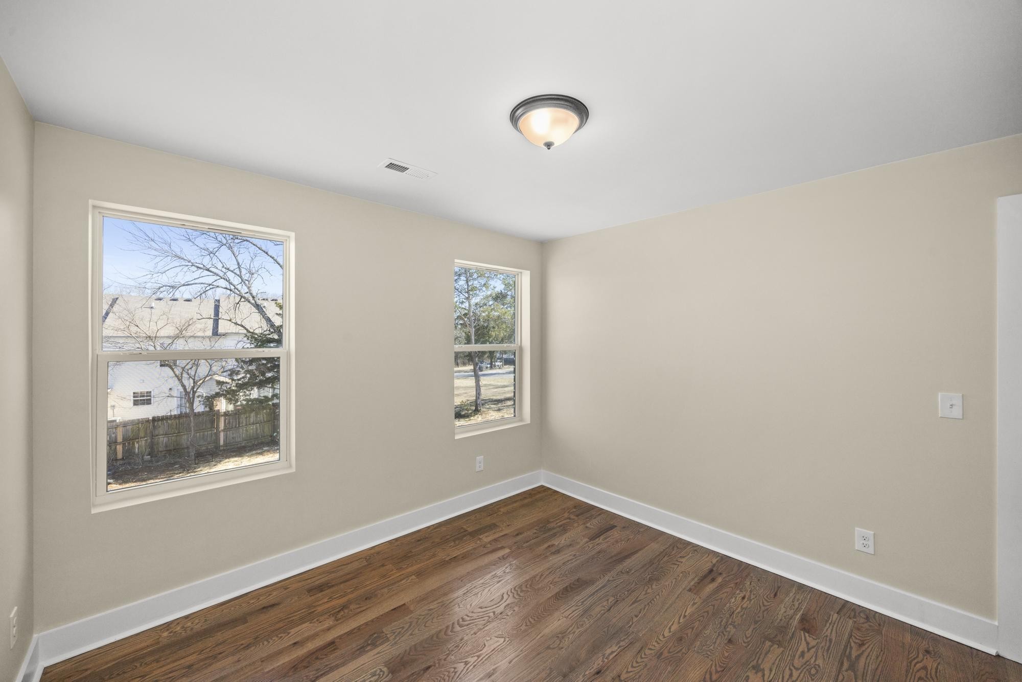 447 Sand Hill Road, Unit 4 La Vergne, TN 37086 - Photo 14 of 27 a view of an empty room with wooden floor and a window