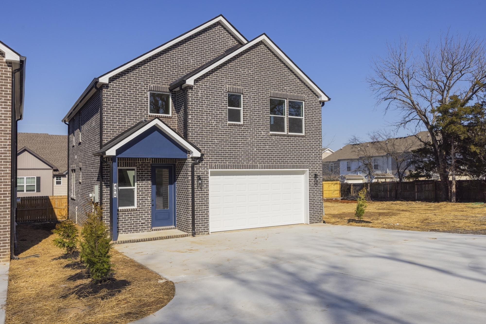 447 Sand Hill Road, Unit 4 La Vergne, TN 37086 - Photo 3 of 27 a front view of a house with a yard