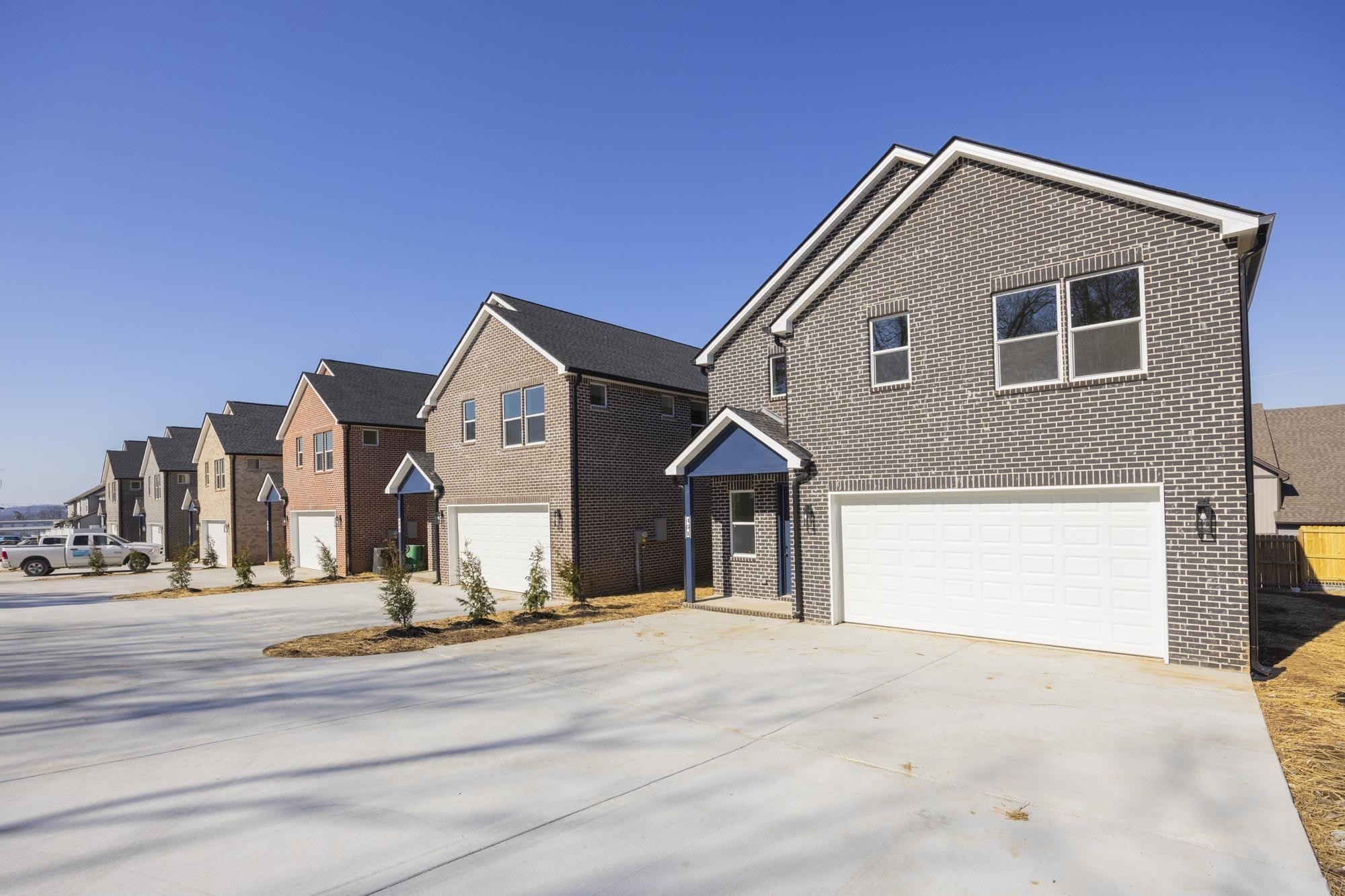 447 Sand Hill Road, Unit 4 La Vergne, TN 37086 - Photo 5 of 27 a front view of a house with a yard