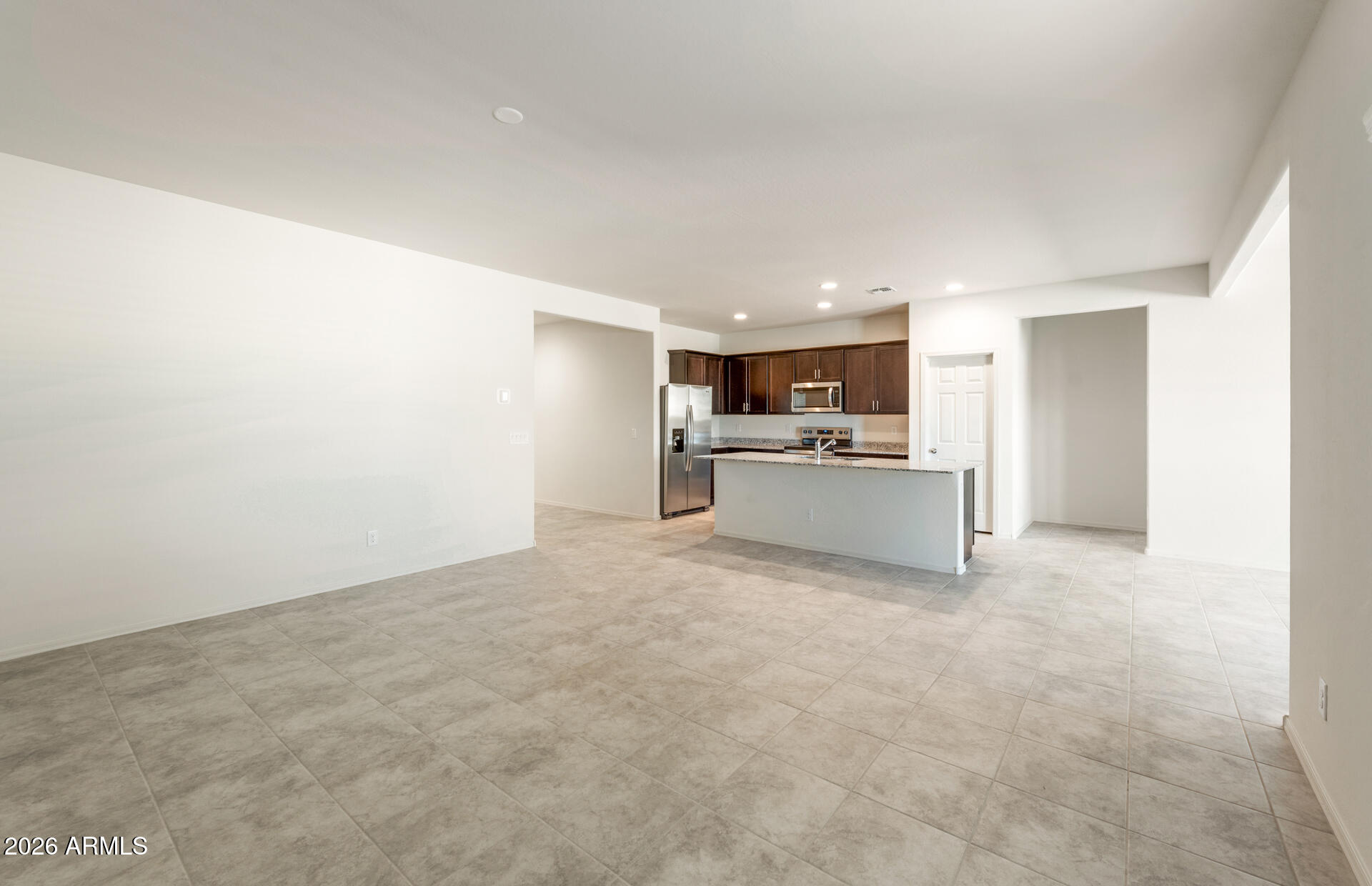 43045 West Palo Amarillo Road Maricopa, AZ 85138 - Photo 9 of 22 8 - Gathering Room and Kitchen