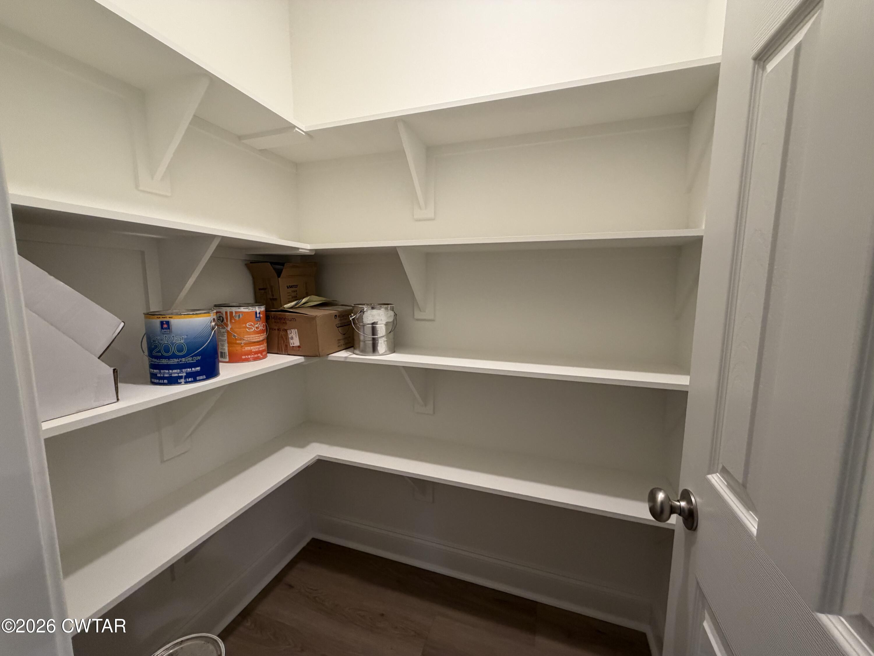 11 Grande Pnes Cove Jackson, TN 38305 - Photo 13 of 13 a refrigerator with a wooden floor