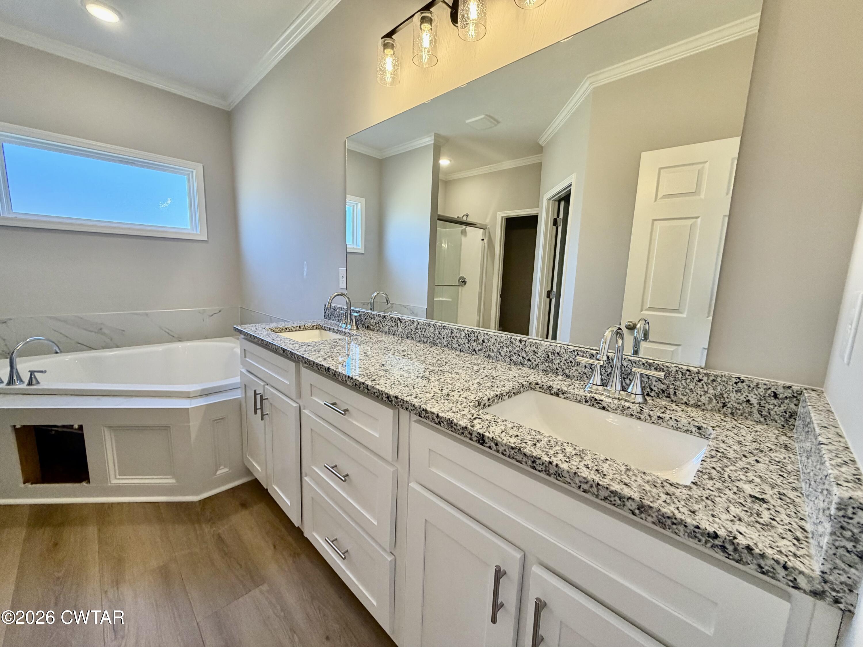 11 Grande Pnes Cove Jackson, TN 38305 - Photo 8 of 13 a bathroom with a sink and a mirror