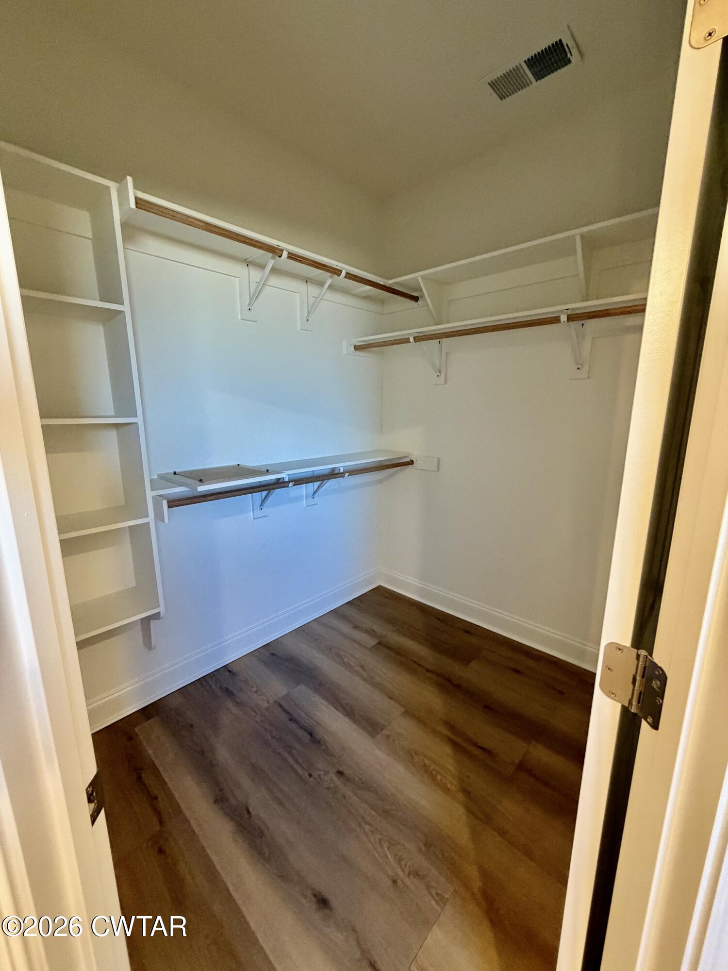 11 Grande Pnes Cove Jackson, TN 38305 - Photo 10 of 13 a view of walk in closet with empty racks