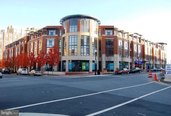 a city street lined with buildings and cars